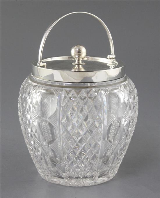 An Edwardian silver mounted cut glass biscuit barrel and cover, by John Grinsell & Sons, 15.5cm.